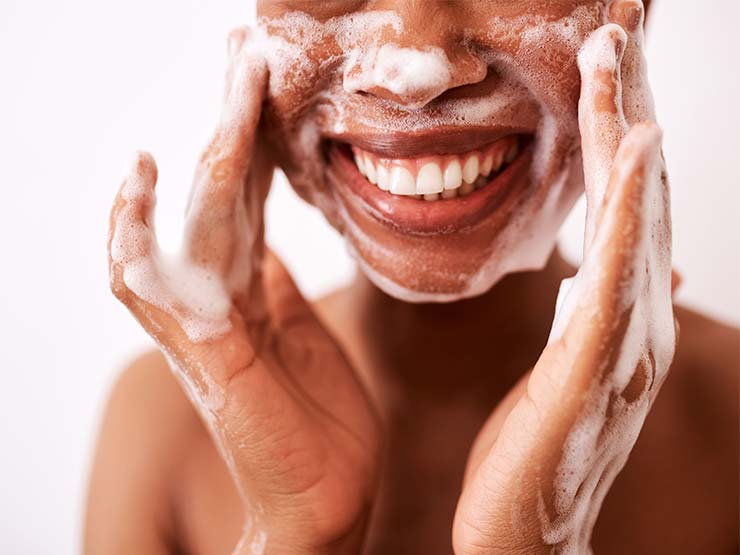 image of person washing face